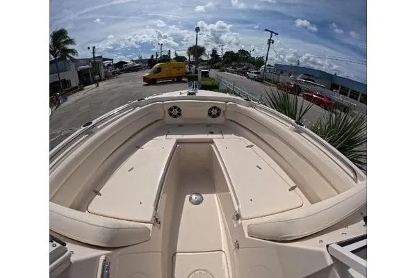 Slide: The Image of 2024 Grady-White Freedom 235 boat interior with spacious seating and storage compartments. - 4
