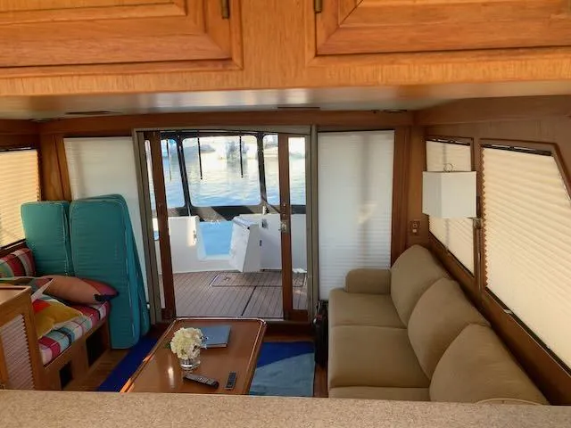 Slide: The Image of Interior of 1986 Ocean Alexander 39 Sedan yacht with cozy seating and wooden accents. - 10