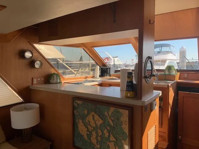 Slide: The Image of Interior of 1986 Ocean Alexander 39 Sedan yacht with wooden cabinetry and nautical decor. - 14