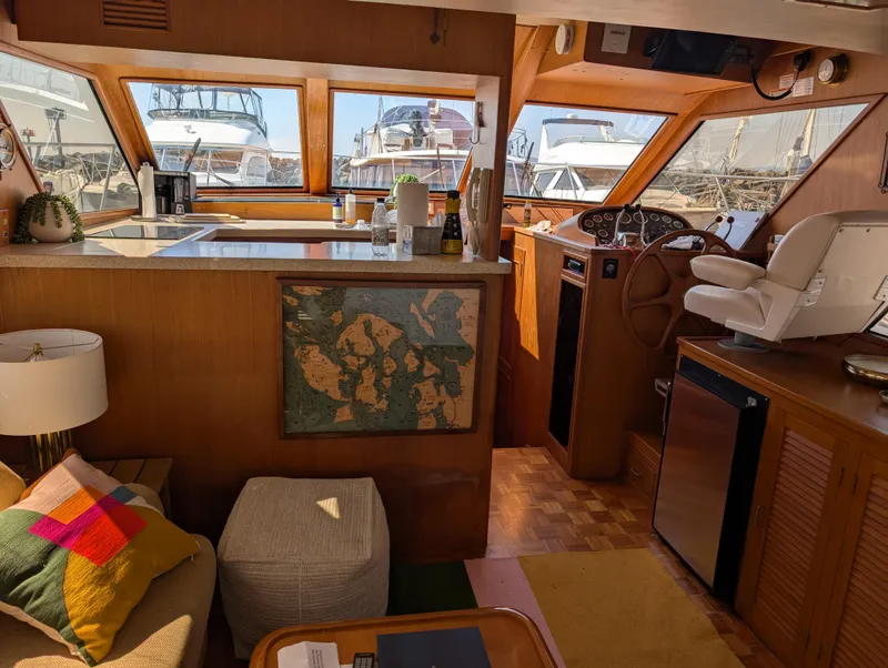Slide: The Image of Interior of 1986 Ocean Alexander 39 Sedan yacht with helm, seating, and kitchen area. - 15
