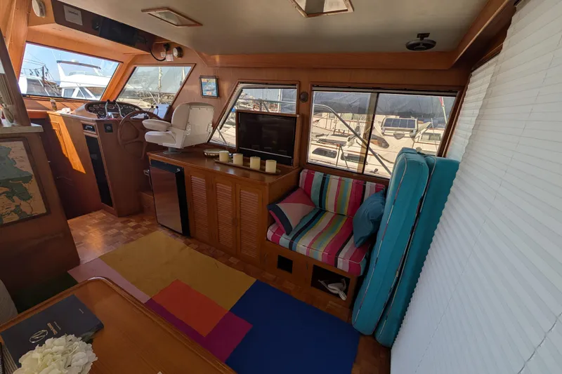 Slide: The Image of Interior of 1986 Ocean Alexander 39 Sedan with colorful seating and nautical decor. - 17