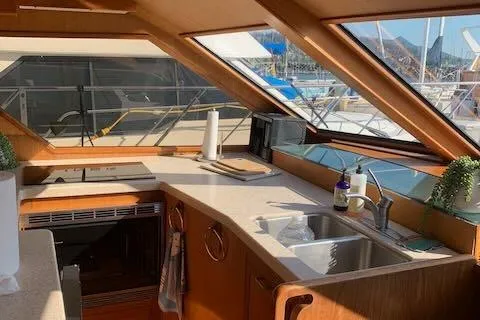 Slide: The Image of Interior of 1986 Ocean Alexander 39 Sedan yacht kitchen with sink and stove. - 22