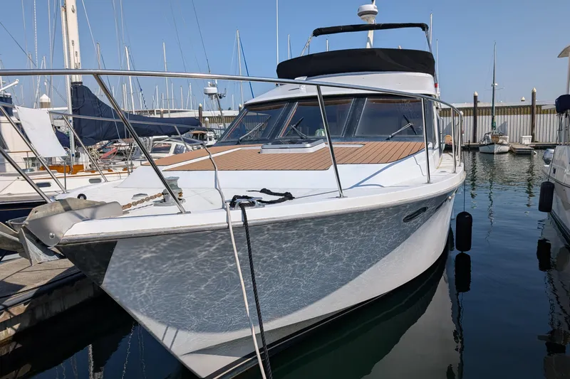 Slide: The Image of 1986 Ocean Alexander 39 Sedan yacht docked in marina. - 4