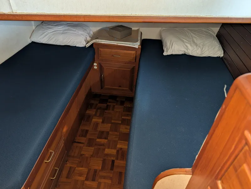 Slide: The Image of 1986 Ocean Alexander 39 Sedan cabin with twin beds and wooden cabinetry. - 47