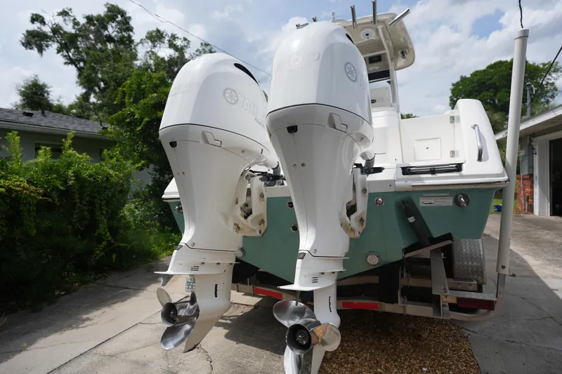 Slide: The Image of 2017 Everglades 255 boat with dual outboard motors on a trailer. - 2