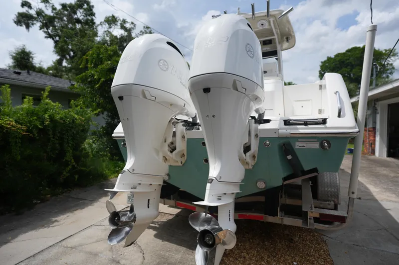 Slide: The Image of 2017 Everglades 255 boat with dual Yamaha outboard engines on a driveway. - 3