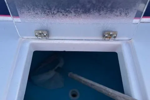 Slide: The Image of Open storage compartment on 2015 Maritime Skiff 23 Patriot boat. - 15