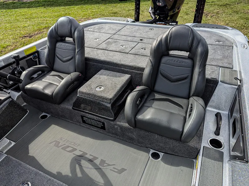 Slide: The Image of 2025 Falcon F20 PREDATOR boat interior with two black leather seats and storage compartments. - 10