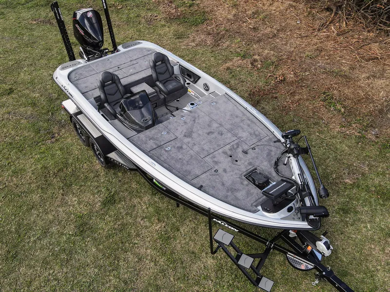 Slide: The Image of 2025 Falcon F20 PREDATOR fishing boat on grass, featuring dual seats and advanced equipment. - 13