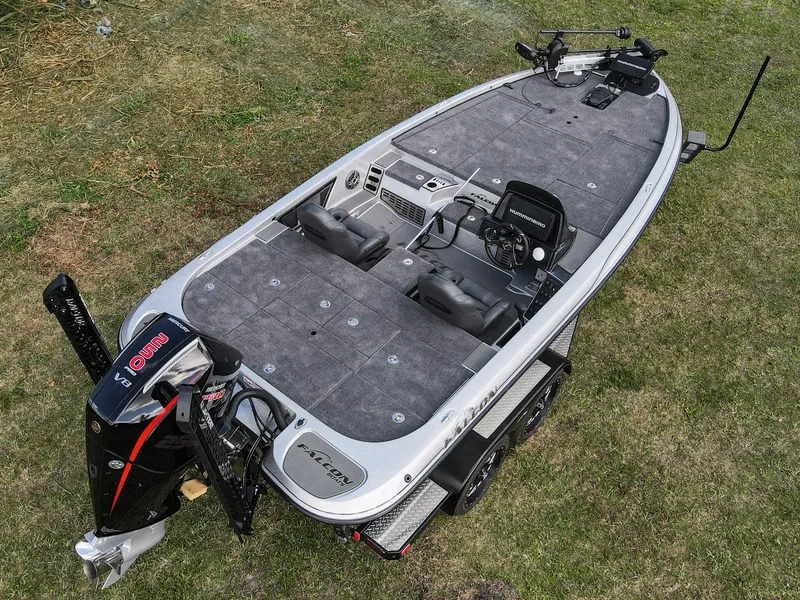 Slide: The Image of 2025 Falcon F20 PREDATOR fishing boat on grass, featuring modern design and equipment. - 14