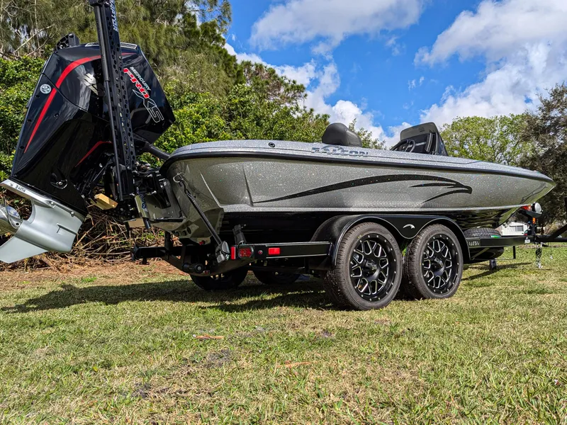 Slide: The Image of 2025 Falcon F20 PREDATOR boat on trailer, parked on grass under a blue sky. - 3