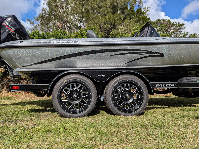 Slide: The Image of 2025 Falcon F20 PREDATOR boat on trailer, featuring sleek design and dual wheels. - 4