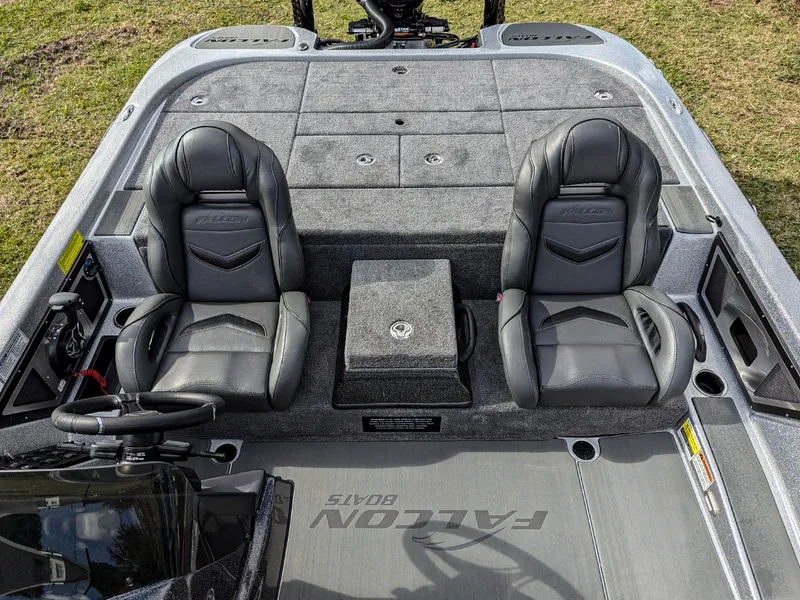 Slide: The Image of 2025 Falcon F20 PREDATOR boat interior with dual black seats and storage compartments. - 9