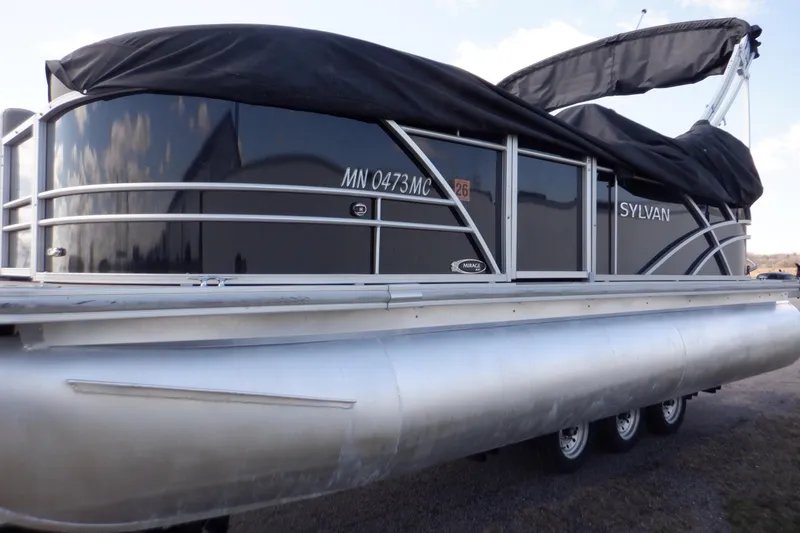 Slide: The Image of 2021 Sylvan Mirage 820 LZ pontoon boat with black cover on a trailer. - 11
