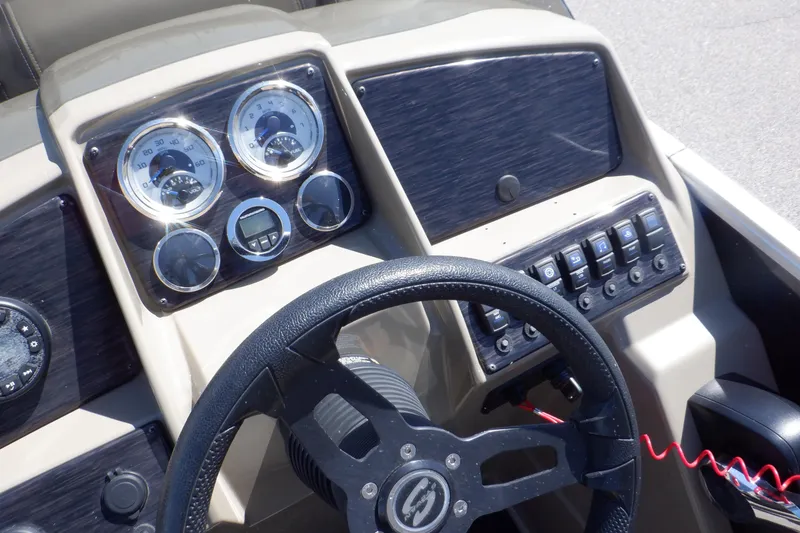 Slide: The Image of Steering console of 2021 Sylvan Mirage 820 LZ with gauges and control panel. - 21