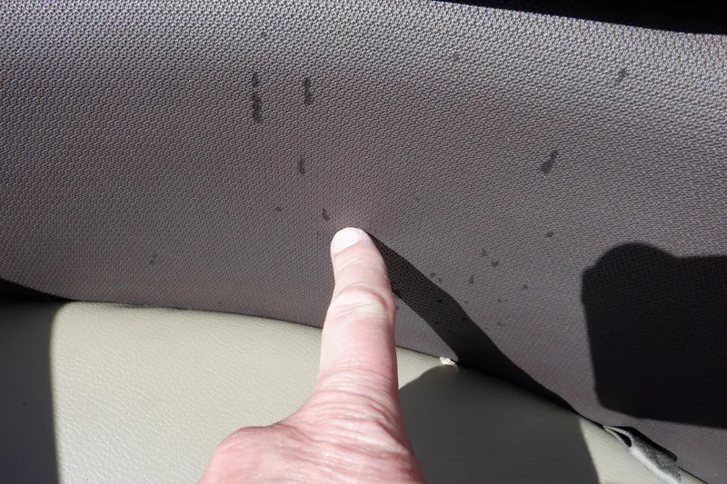Slide: The Image of Finger pointing at fabric texture on 2021 Sylvan Mirage 820 LZ interior. - 30
