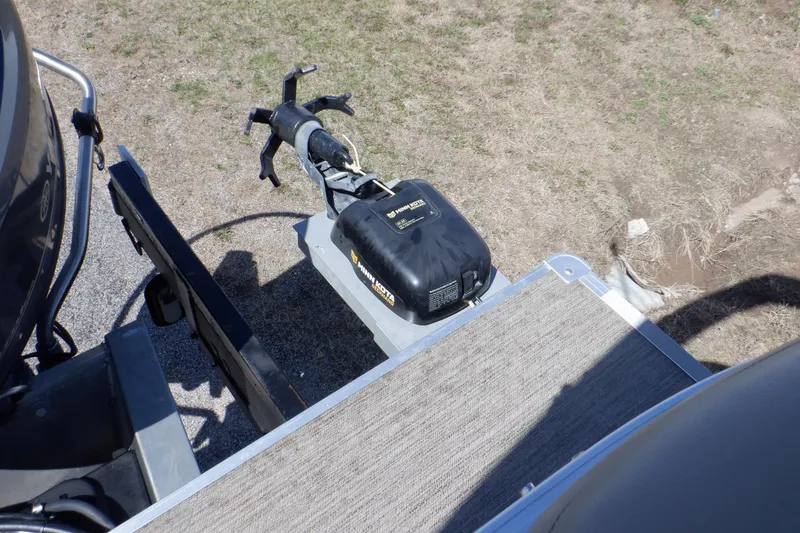 Slide: The Image of 2021 Sylvan Mirage 820 LZ boat with motor, viewed from above on grassy terrain. - 32