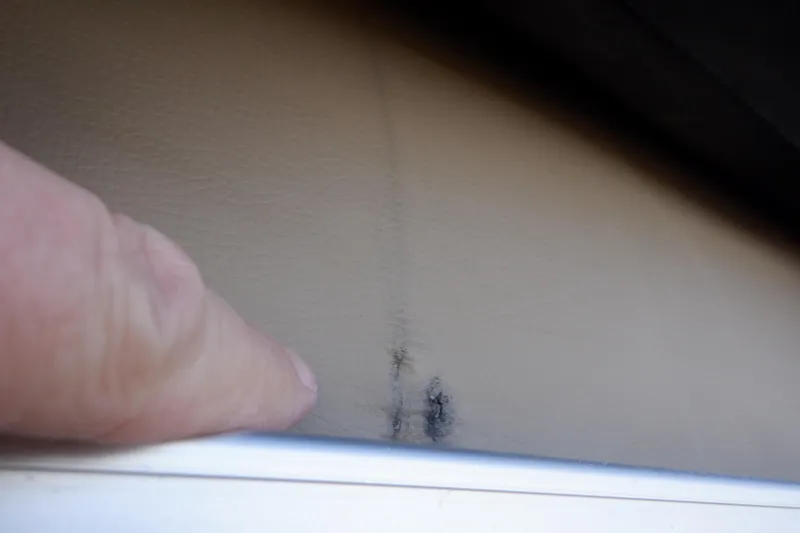 Slide: The Image of Close-up of a finger pointing at a mark on a 2021 Sylvan Mirage 820 LZ. - 44