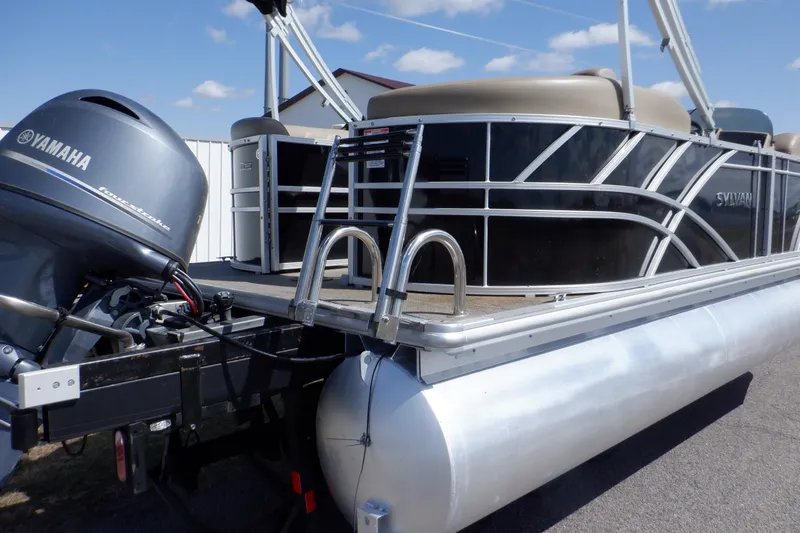 Slide: The Image of 2021 Sylvan Mirage 820 LZ pontoon boat with Yamaha engine, docked outdoors. - 5