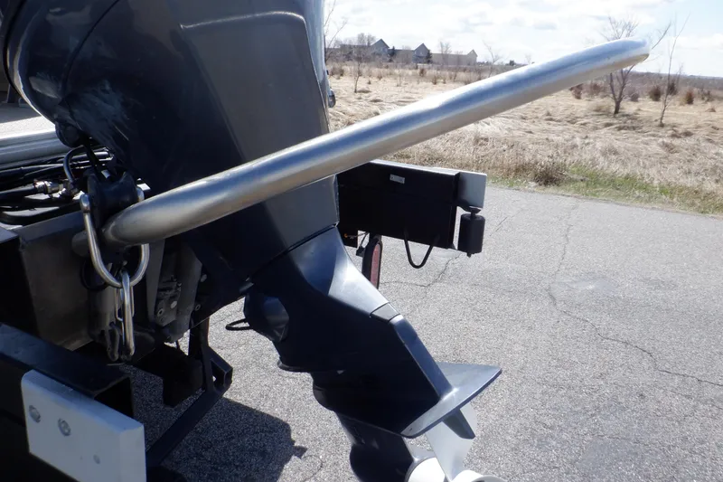 Slide: The Image of Outboard motor of 2021 Sylvan Mirage 820 LZ on a trailer, parked on a road. - 9