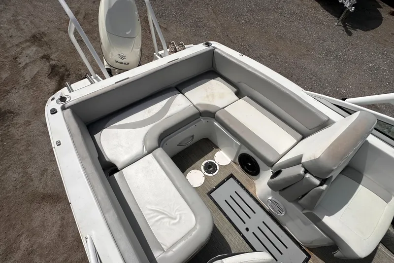 Slide: The Image of 2020 Caravelle 19 EBo Bowrider boat interior with white seating and storage compartments. - 10