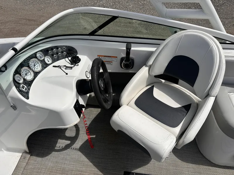 Slide: The Image of 2020 Caravelle 19 EBo Bowrider cockpit with steering wheel and gauges. - 8