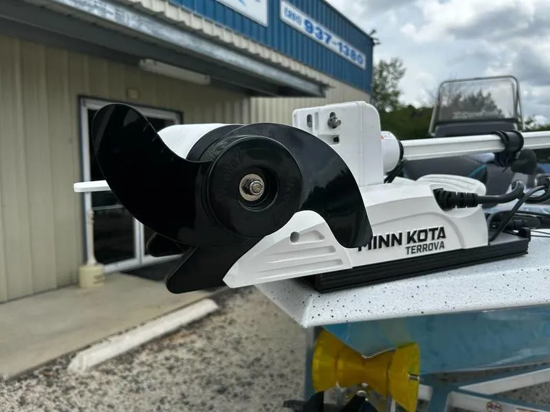 Slide: The Image of Minn Kota Terrova motor on 2025 Xpress X23B Lounge boat, outdoor setting. - 10
