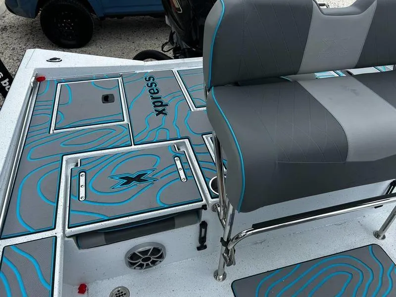 Slide: The Image of 2025 Xpress X23B Lounge boat interior with stylish seating and modern design elements. - 11