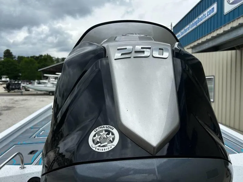 Slide: The Image of Outboard motor on 2025 Xpress X23B Lounge boat, featuring 250 horsepower and ultra-low emissions. - 13