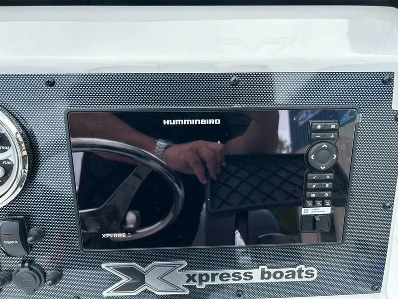 Slide: The Image of Xpress X23B Lounge 2025 dashboard with Humminbird Xplore 9 display. - 15