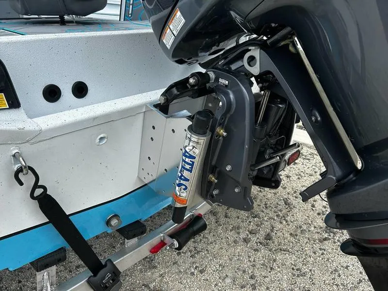 Slide: The Image of Rear view of 2025 Xpress X23B Lounge boat with motor and hydraulic system. - 6