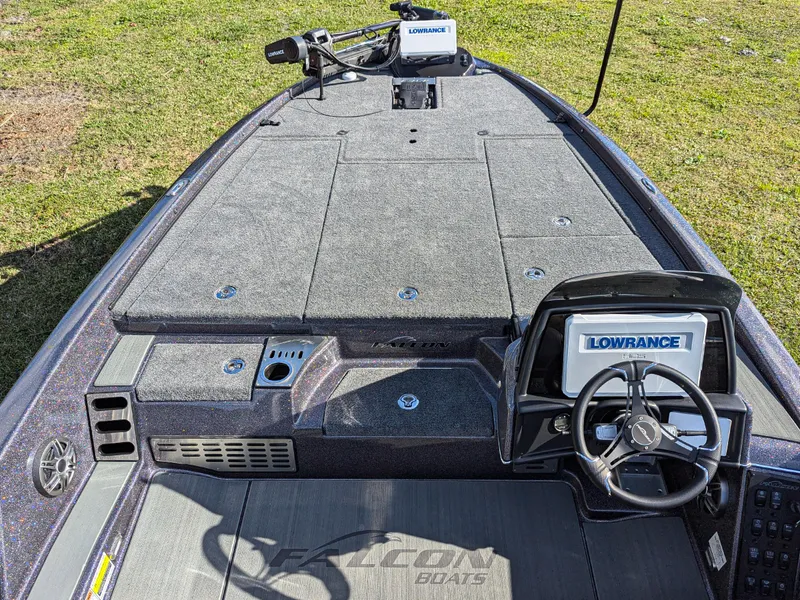 Slide: The Image of 2025 Falcon F20 PREDATOR boat interior with Lowrance electronics, steering wheel, and spacious deck. - 10
