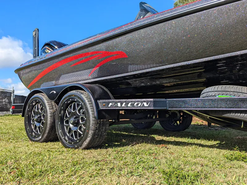 Slide: The Image of 2025 Falcon F20 PREDATOR boat on trailer, featuring sleek design and dual axles. - 3