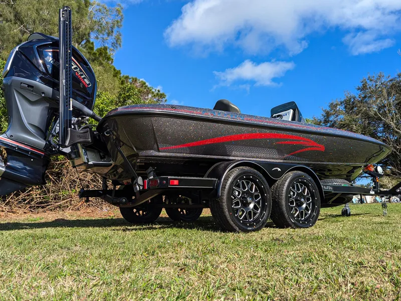 Slide: The Image of 2025 Falcon F20 PREDATOR boat on trailer, grassy area, clear blue sky. - 5