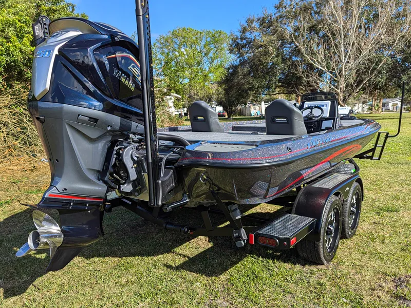 Slide: The Image of 2025 Falcon F20 PREDATOR boat on trailer, featuring powerful outboard motor. - 6