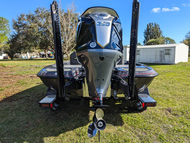 Slide: The Image of 2025 Falcon F20 PREDATOR boat with powerful engine, parked on grass. - 7