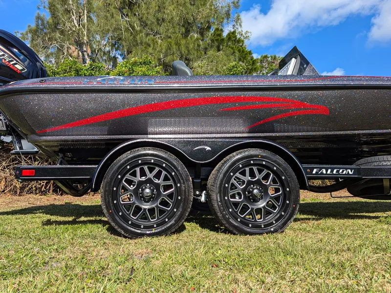 Slide: The Image of 2025 Falcon F20 PREDATOR boat on trailer, featuring sleek design and stylish wheels. - 9