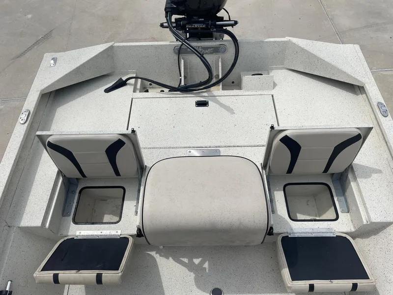 Slide: The Image of 2017 Alumacraft 1860 BAY CC TUNNEL boat interior with open storage compartments. - 13