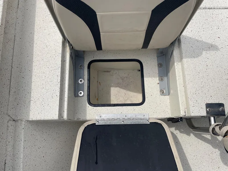 Slide: The Image of 2017 Alumacraft 1860 BAY CC TUNNEL boat seat with storage compartment open. - 15