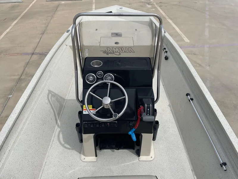 Slide: The Image of 2017 Alumacraft 1860 BAY CC TUNNEL boat console with steering wheel and gauges. - 17