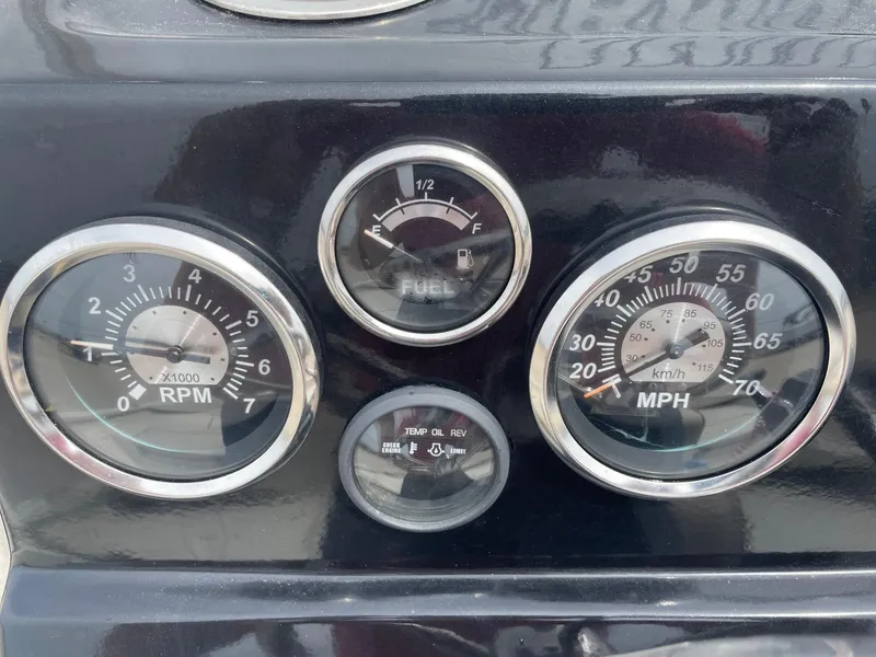 Slide: The Image of Dashboard gauges of a 2017 Alumacraft 1860 BAY CC TUNNEL boat, showing RPM, fuel, and speed. - 18