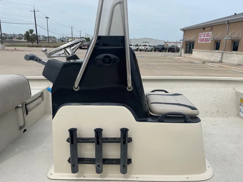 Slide: The Image of 2017 Alumacraft 1860 BAY CC TUNNEL boat console with steering wheel and rod holders. - 20