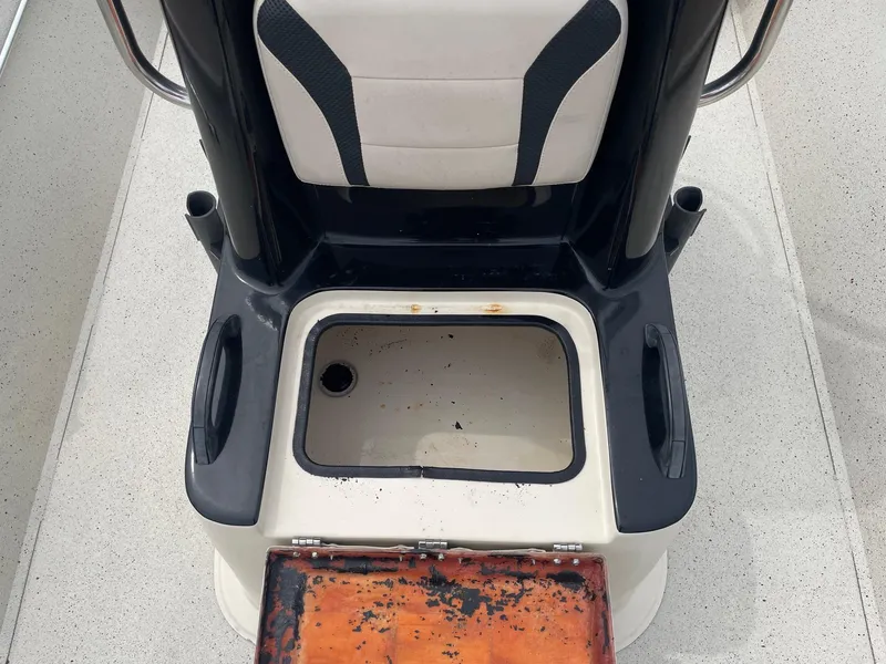 Slide: The Image of 2017 Alumacraft 1860 BAY CC TUNNEL boat seat with storage compartment open. - 23