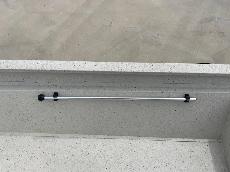 Slide: The Image of 2017 Alumacraft 1860 BAY CC TUNNEL boat interior with mounted rod holder. - 24