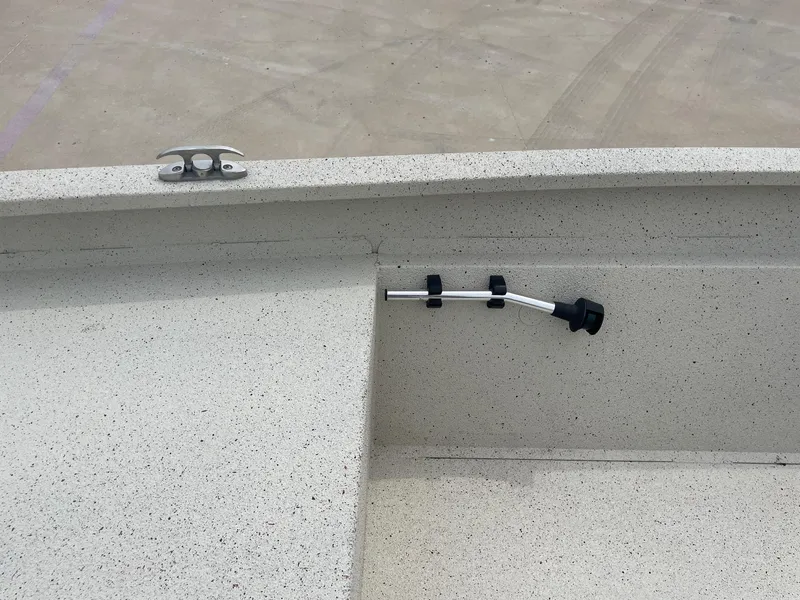 Slide: The Image of 2017 Alumacraft 1860 BAY CC TUNNEL boat interior with cleat and rod holder. - 25