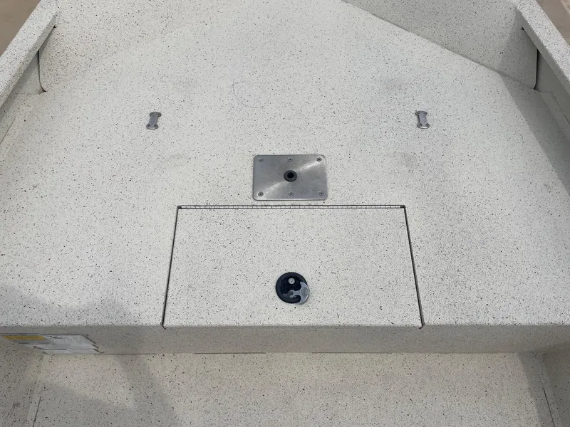 Slide: The Image of 2017 Alumacraft 1860 BAY CC TUNNEL boat deck with storage compartment and mounting plate. - 27