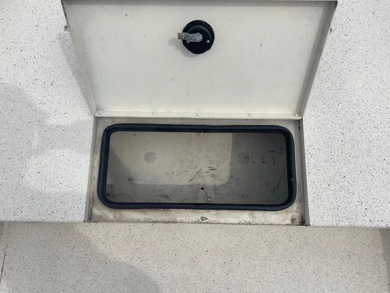 Slide: The Image of Open storage compartment on 2017 Alumacraft 1860 BAY CC TUNNEL boat. - 28