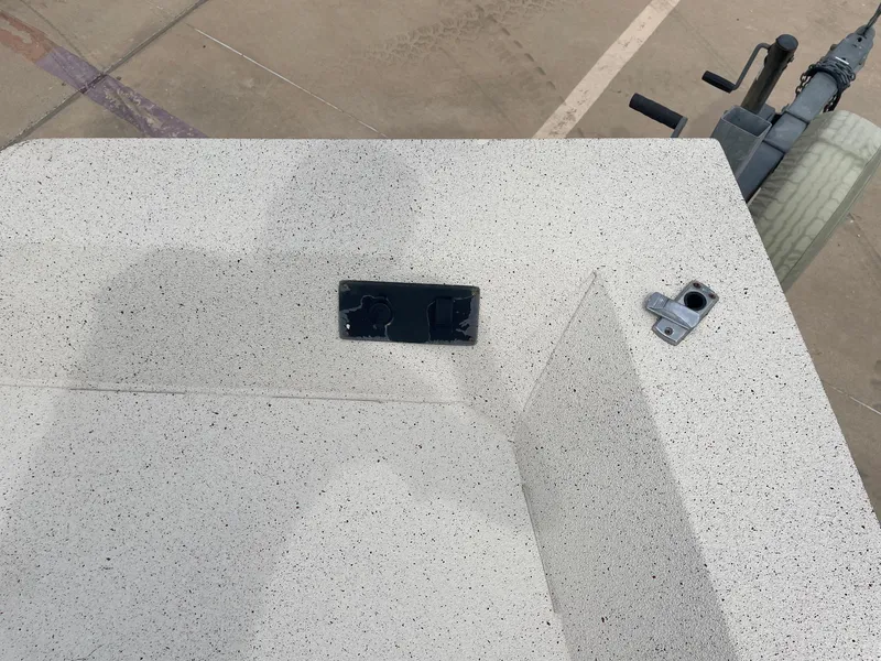 Slide: The Image of 2017 Alumacraft 1860 BAY CC TUNNEL boat deck with hardware and trailer visible. - 29