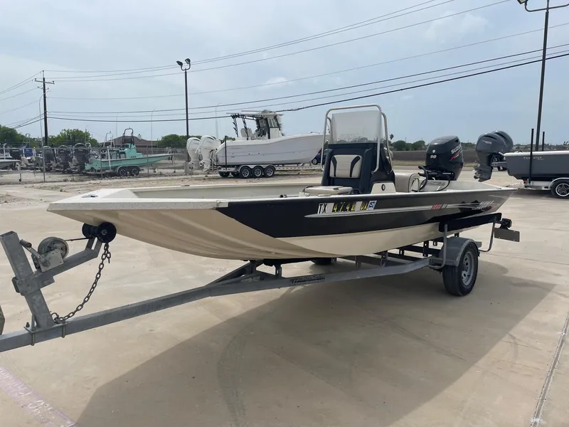 Slide: The Image of 2017 Alumacraft 1860 BAY CC TUNNEL boat on trailer, parked outdoors. - 3