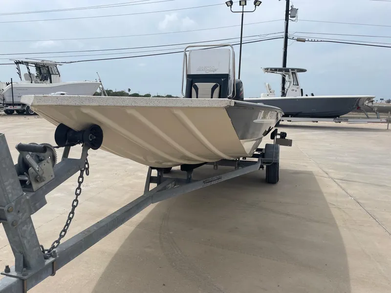 Slide: The Image of 2017 Alumacraft 1860 BAY CC TUNNEL boat on trailer in outdoor lot. - 5